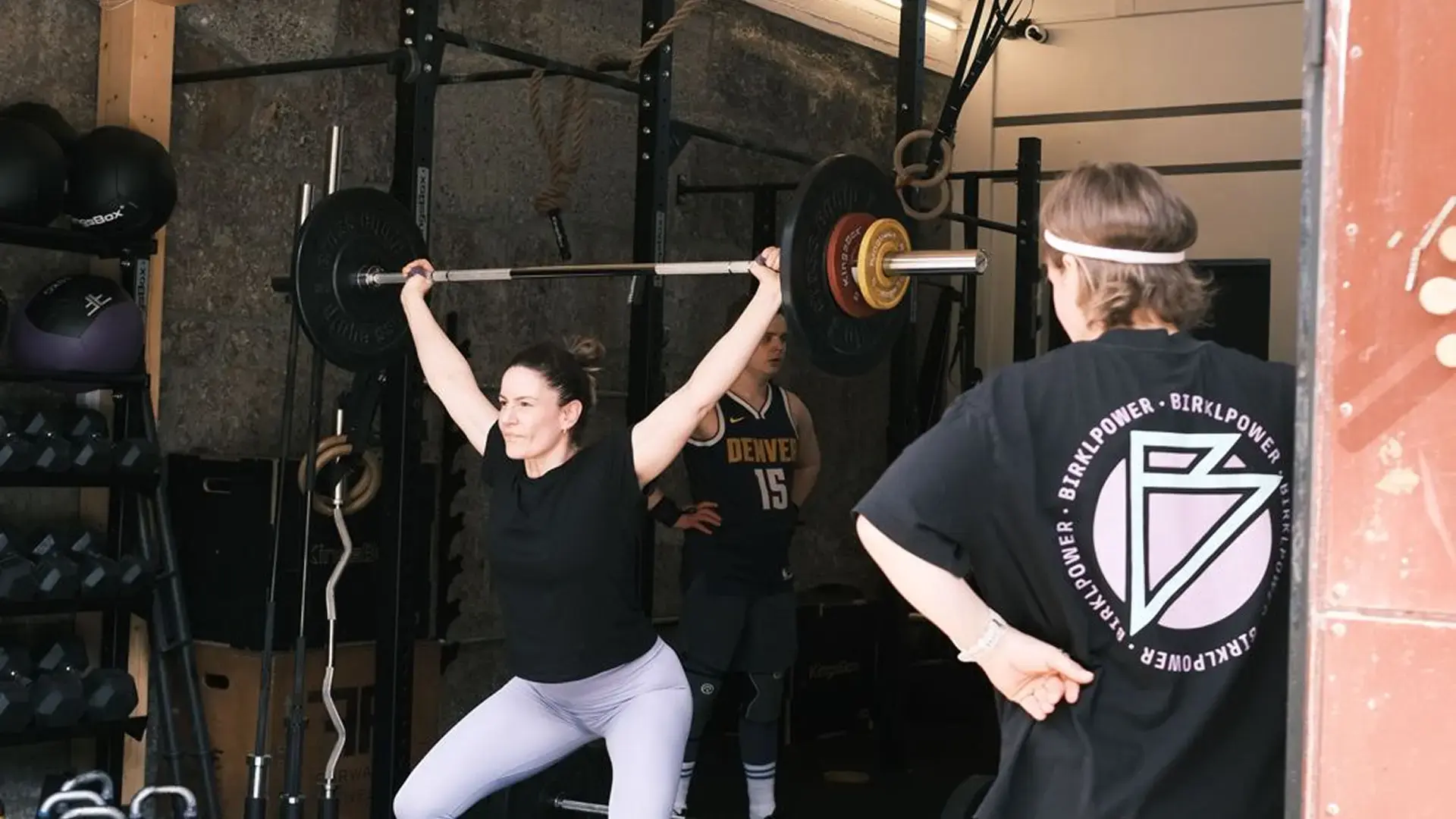 Britta coaching an athlete at Barbell 125